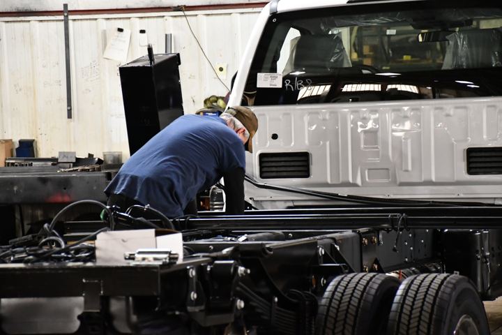 Assembly shop mounting a deck to a chassis