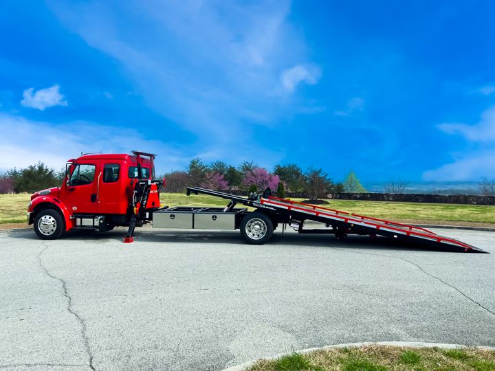 Red Freightliner with sidepuller, bed extended